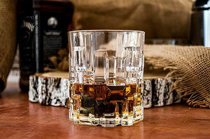 RCR Etna DOF Whiskey Glasses featuring a textured design and filled with whiskey on a wooden surface