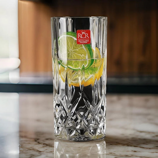 RCR Opera Cocktail Tumbler Set featuring a crystal glass filled with lemon and lime slices