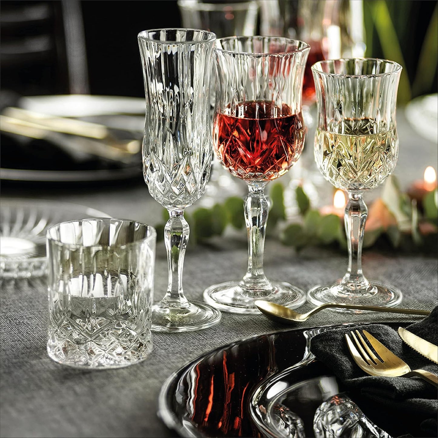 RCR Opera Flute Goblet and wine glasses on an elegant dinner table setting with candles and cutlery