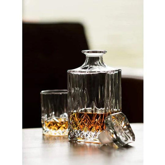 Elegant RCR opera whiskey decanter set with crystal finish and matching glass for serving fine spirits