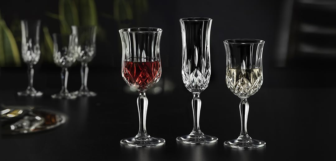 RCR Opera White Wine Glasses set on a dark background, highlighting their brilliant crystal and design details
