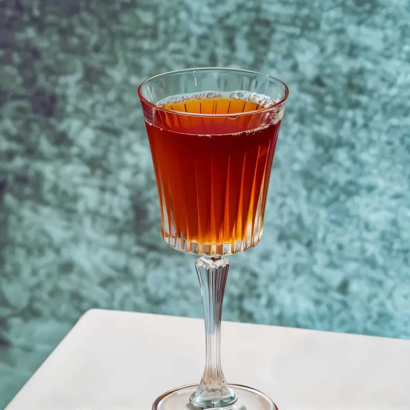 RCR Timeless Red Wine Glasses featuring elegant design with a rich red wine served inside