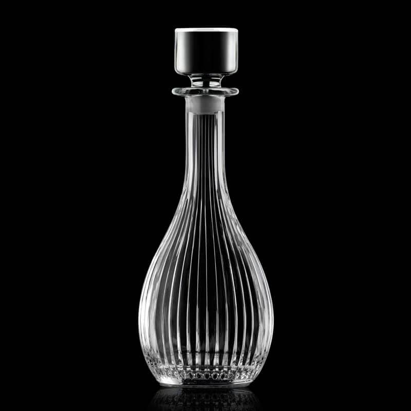 RCR Timeless Round Whiskey Decanter Bottle on a dark background, highlighting the brilliant crystal cut design