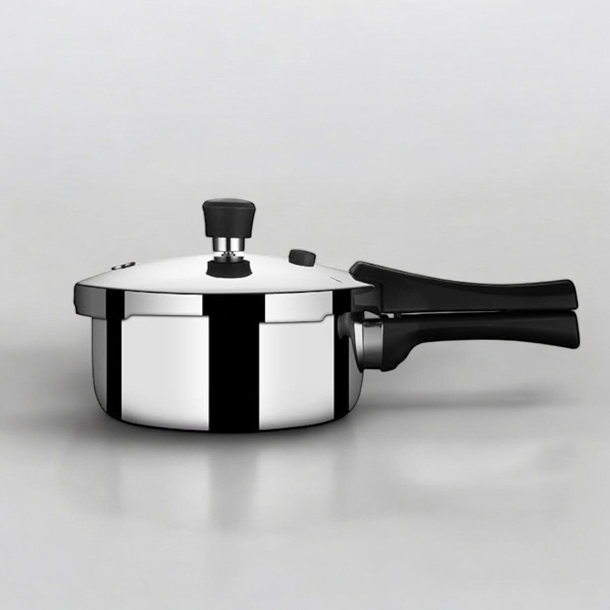 Stahl Xpress Triply Pressure Cooker 5 liters Broad with a glossy stainless steel finish and ergonomic handle